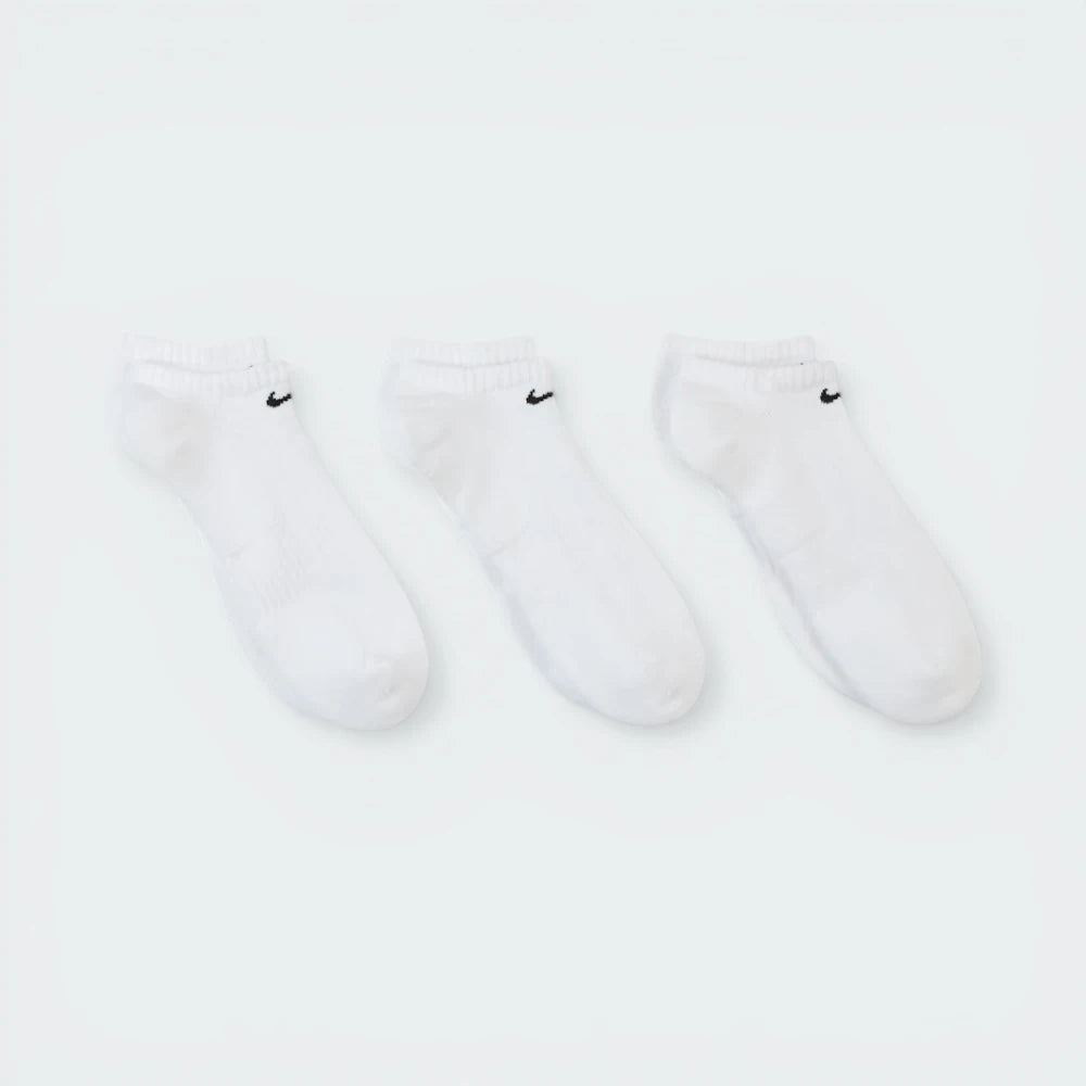 Looking down at the three pairs laid out, showcasing the uniform white knit and the ribbed arch band detail.