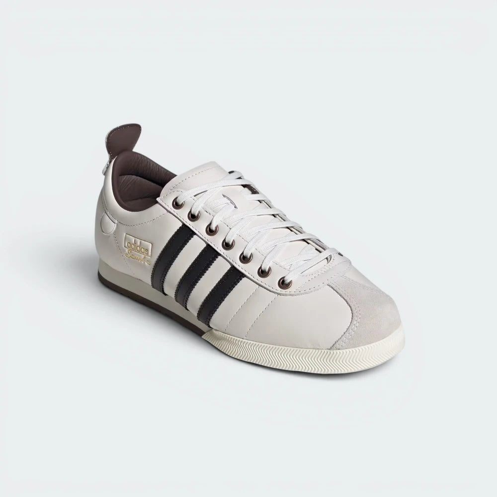 Emphasising the updated 1960s silhouette and the professional integration of the rich brown rubber toe bumpers.