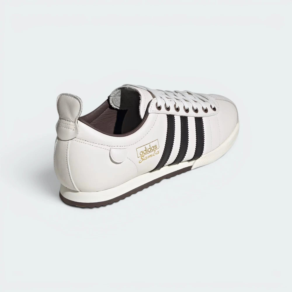 Focuses on the structured low-top rear profile and the clean, classic wedge sole layering under the heel.
