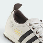 Highlights the "unreal" finish of the mid-sole wedge construction and its stable, robust bonding to the leather upper.