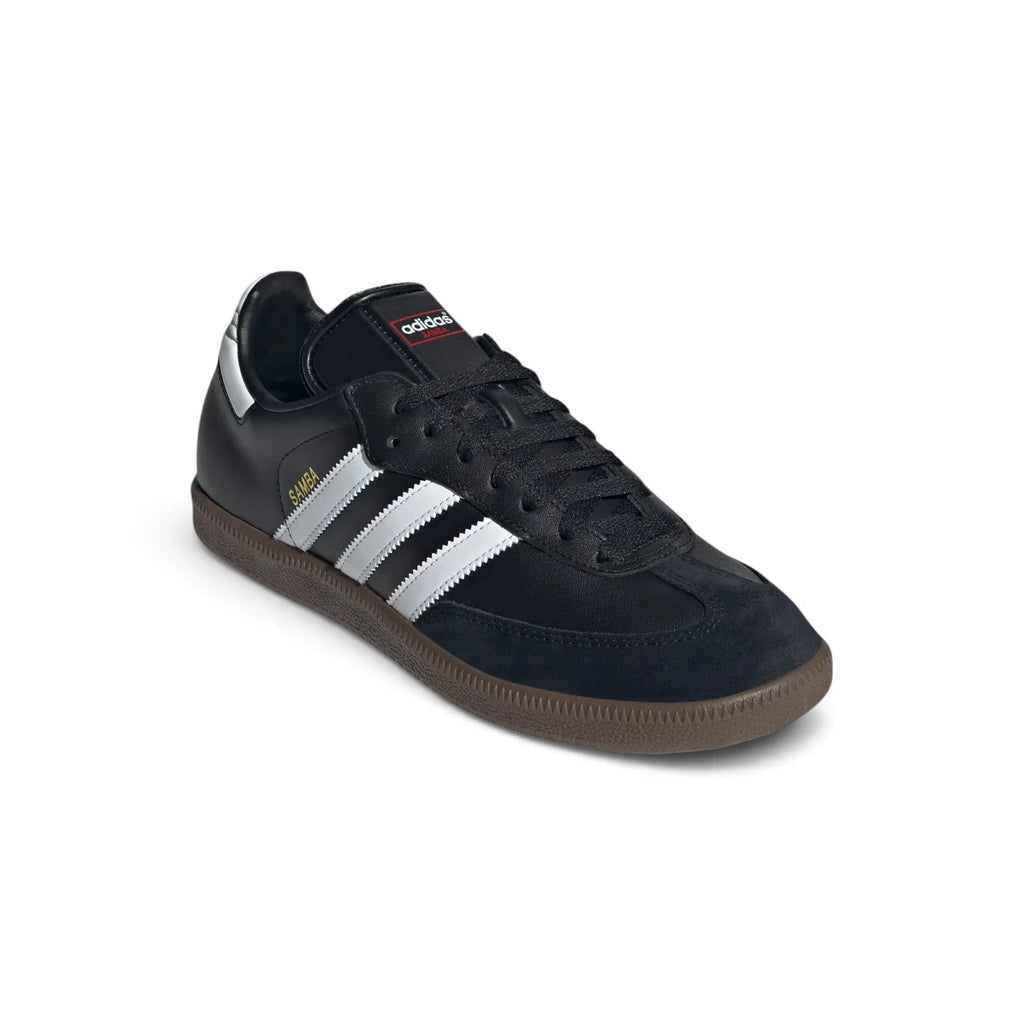 Angled front-three-quarter perspective capturing the reinforced suede T-toe, smooth leather side panels, and the sleek low-profile silhouette.
