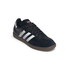 Angled front-three-quarter perspective capturing the reinforced suede T-toe, smooth leather side panels, and the sleek low-profile silhouette.