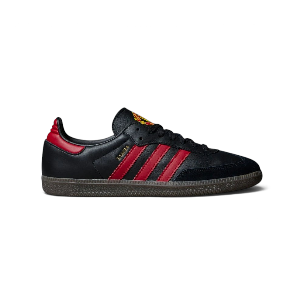 The Manchester United Samba, highlighting the Real Red 3-Stripes and the iconic translucent gum sole. Main image