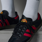 A close-up of the smooth leather grain and the precision stitching on the black T-toe.