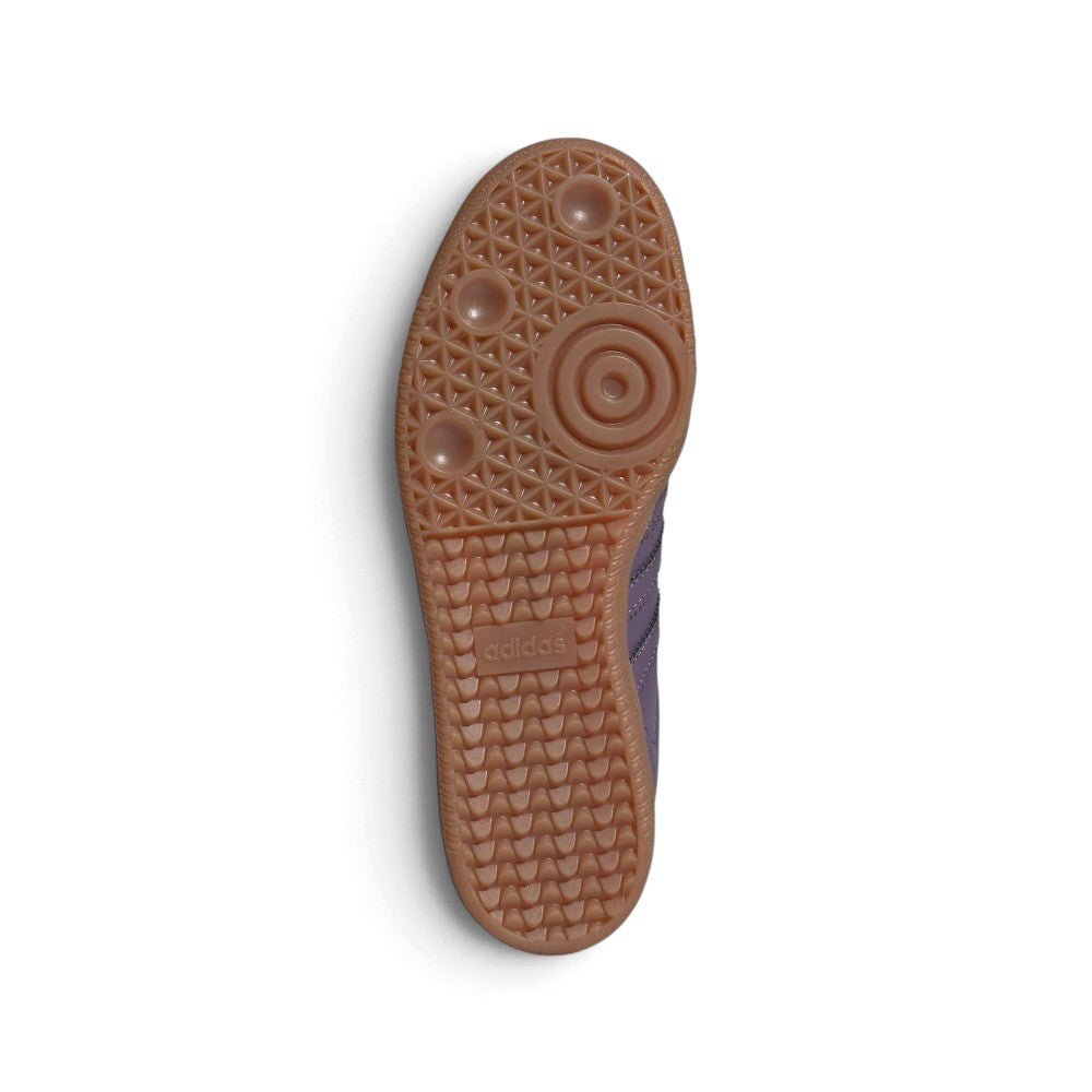 Outsole View: Bottom-down view of the amber gum rubber outsole, showcasing the iconic tread pattern, pivot circles, and central embossed adidas branding block.   