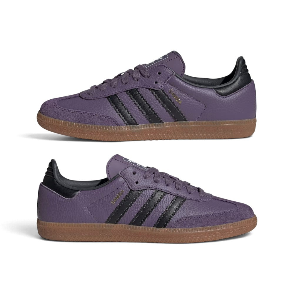 Two purple Adidas Samba sneakers shown from the side against a white background, featuring black three-stripes, black heel tab, and brown gum soles.