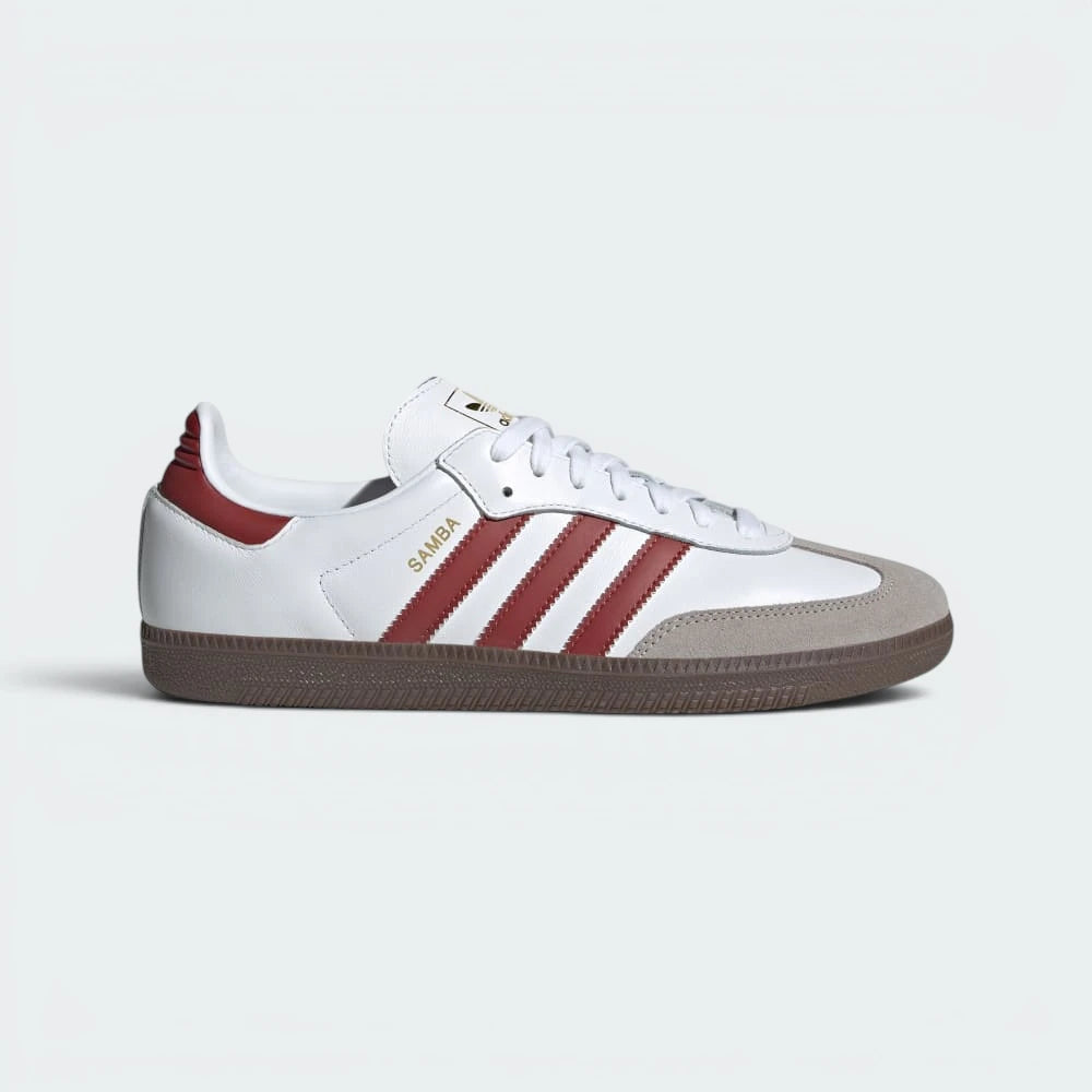 Highlights the high-velocity Preloved Ruby 3-Stripes and the professional, gleaming depth of the metallic gold foil Samba branding. Main image