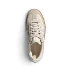 Top-Down View of Pair/Item: Overhead view looking down at the laced beige shoes, displaying the tonal flat laces, tongue label with embossed adidas branding, and clean branded insole.   