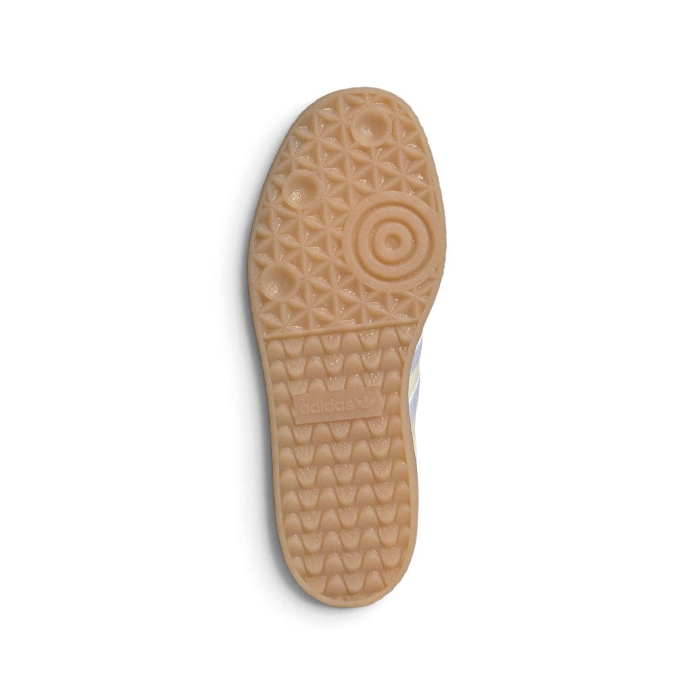 Outsole View: Bottom-down view of the translucent gum rubber platform outsole, showcasing the heritage pivot circles, geometric tread pattern, and central embossed adidas branding.   