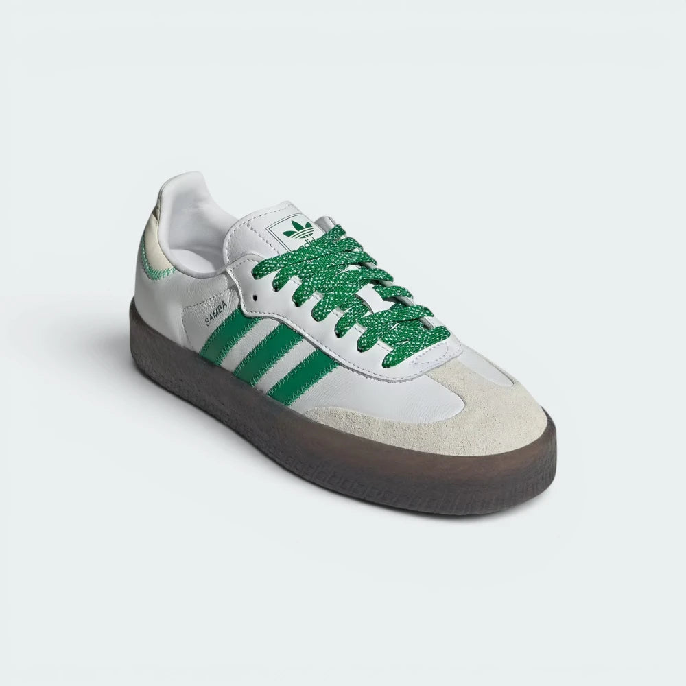 Emphasising the elevated platform stance and the professional harmony of the crisp white leather base against the green accents.