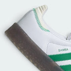 Highlights the "unreal" textured finish of the stacked gum rubber walls and its robust, clean bonding to the white upper leather.