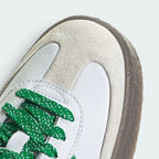 Details the premium stitching lines crossing the off-white toe guard and the precision lace configuration eyelets.