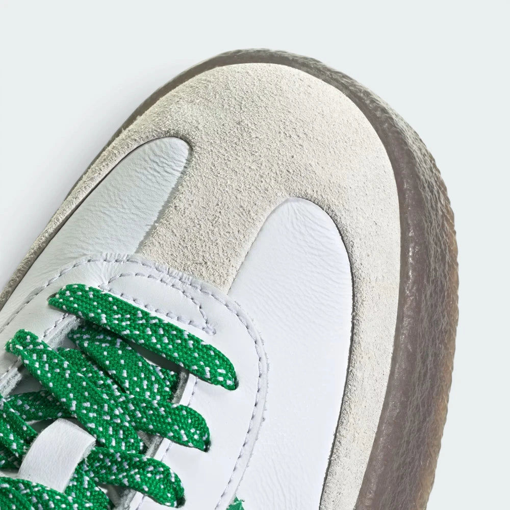 Details the premium stitching lines crossing the off-white toe guard and the precision lace configuration eyelets.