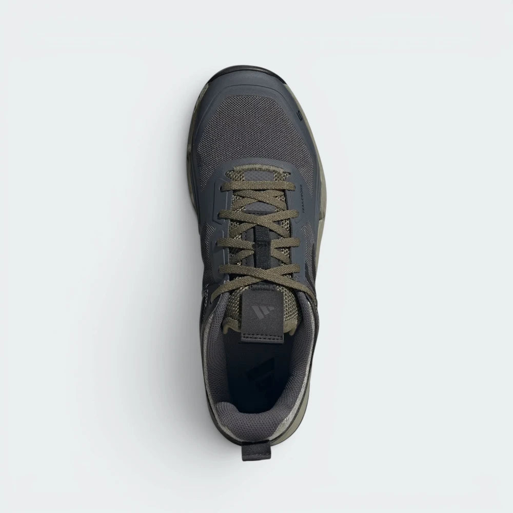 Focuses on the locked-in traditional lacing layout, displaying the perfect symmetry of the textile mesh tongue, the high-tension eyelets, and the smooth protective arc of the dark moulded toe cap guarding the front box.