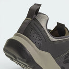 Highlights the "unreal" clean finish where the high-friction trail rubber base bonds securely to the shock-absorbing compression-molded EVA midsole carrier.