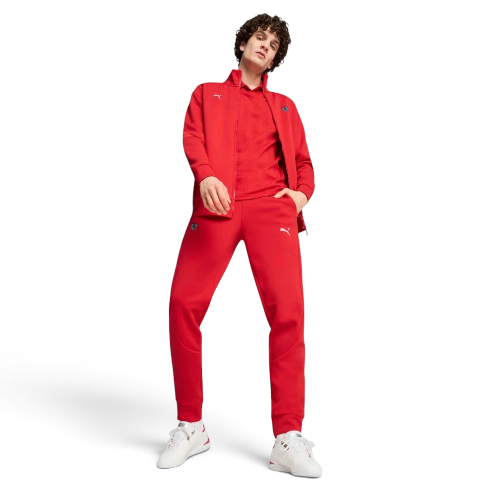 Person wearing a red tracksuit with a brand logo on a white background