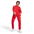 Person wearing a red tracksuit with a brand logo on a white background