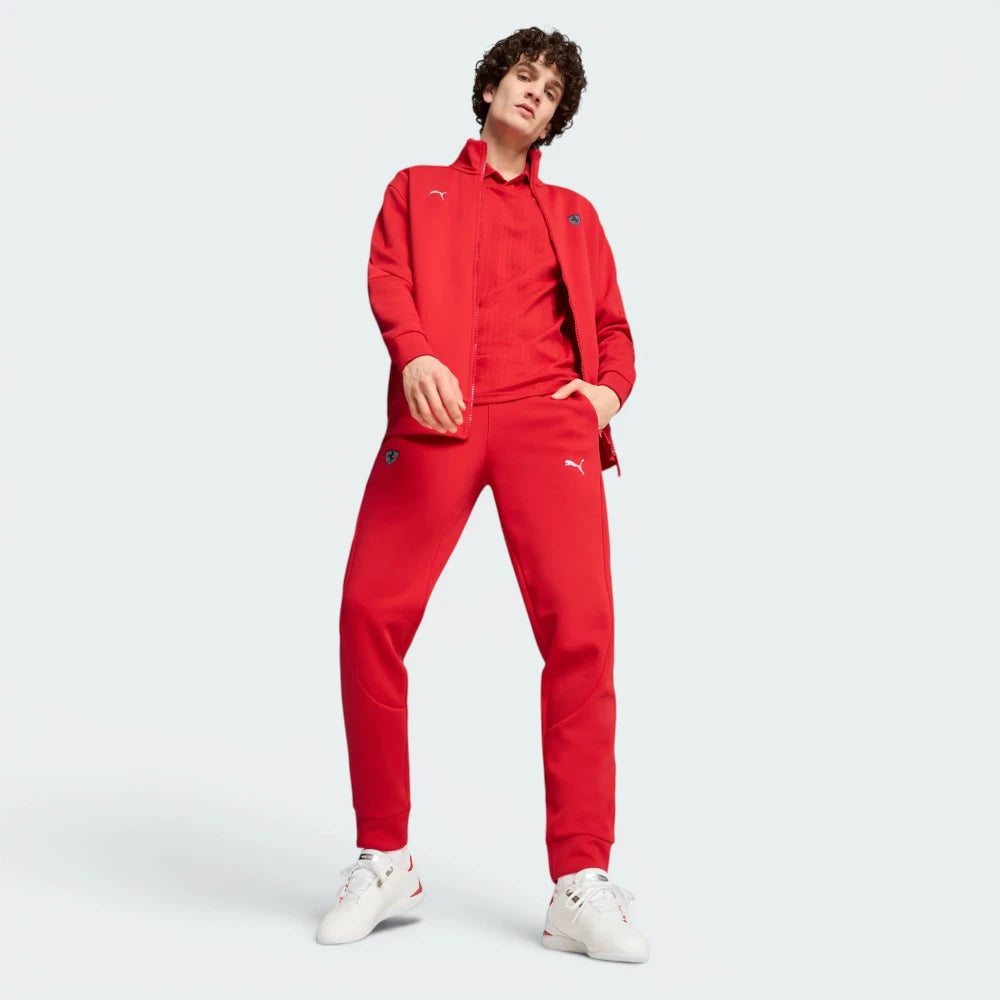 Person wearing a red tracksuit with a brand logo on a white background