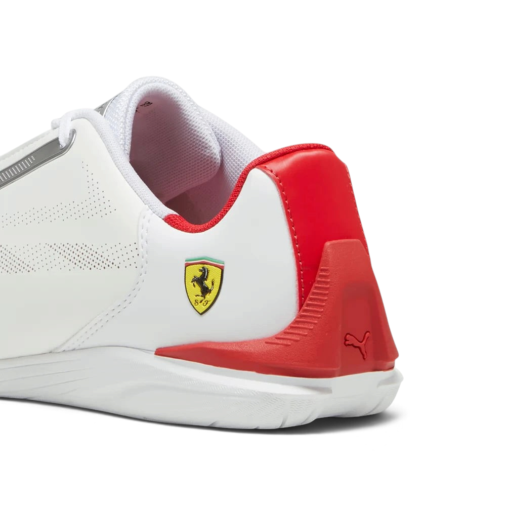 Focuses on the rounded driver's heel wrap architecture and the clean finish of the signature metal cat logo badge.