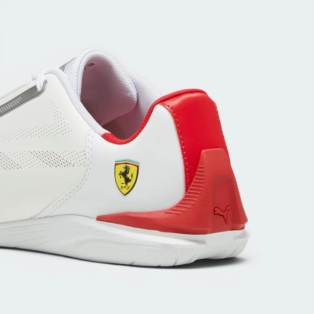 Focuses on the rounded driver's heel wrap architecture and the clean finish of the signature metal cat logo badge.
