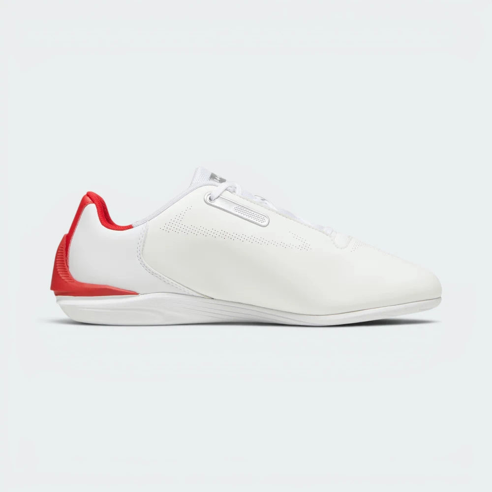 White sneaker with red accents on a light gray background