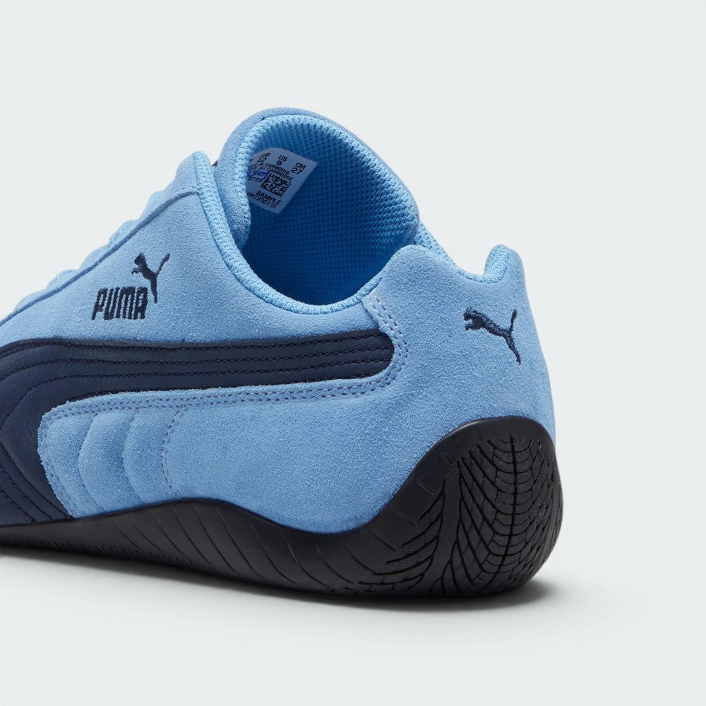 Focuses on the rounded driver's heel and the professional finish of the suede wrap.