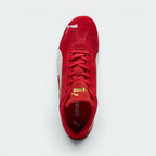 Focuses on the locked-in traditional lacing layout, displaying the clean symmetry of the red suede tongue, the gold foil Puma logo, and the breathable black OrthoLite® footbed inside.