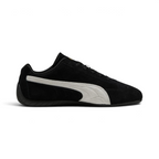 Highlights the high-velocity, low-slung silhouette of the shoe, showing the clean sweep of the white suede Formstrip against the black upper and the thin, textured black sole wrapping up the heel.