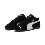 Emphasises the low-profile, forward-leaning athletic stance of the trainers, highlighting the classic sport harmony of the black suede and white leather accents.