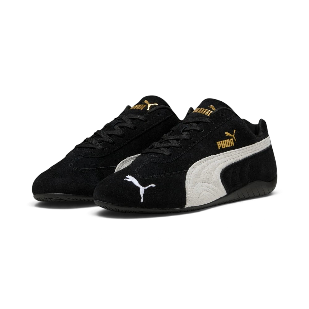 Emphasises the low-profile, forward-leaning athletic stance of the trainers, highlighting the classic sport harmony of the black suede and white leather accents.