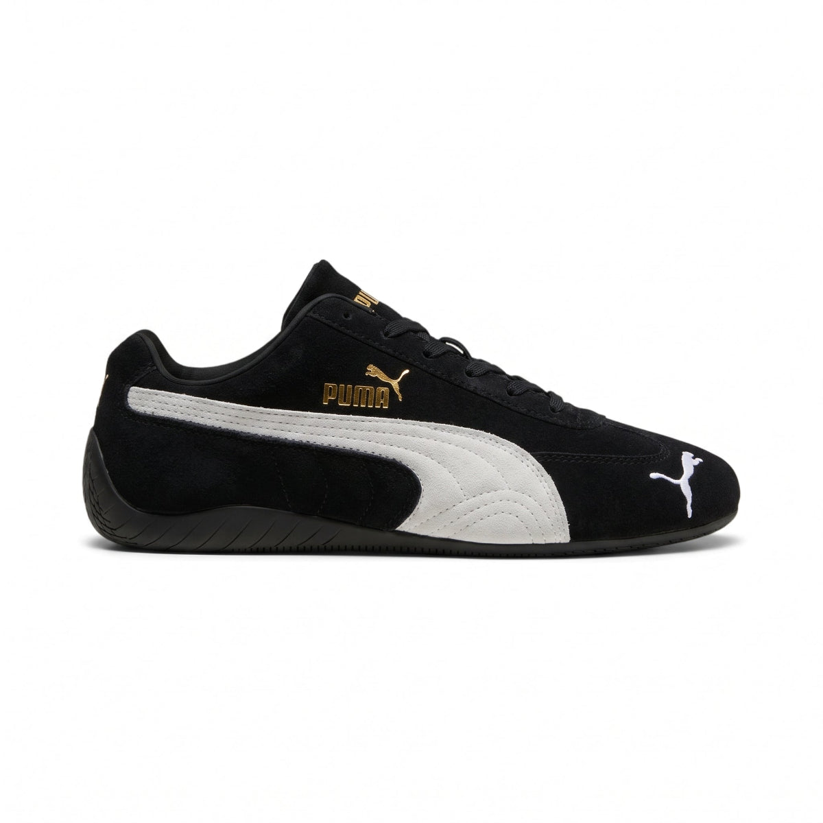 Highlights the "unreal" low-profile interface where the slim black rubber sole meets the suede upper, emphasizing the minimalist motorsport design. Main image