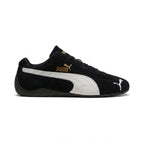 Highlights the "unreal" low-profile interface where the slim black rubber sole meets the suede upper, emphasizing the minimalist motorsport design.