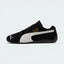 Highlights the "unreal" low-profile interface where the slim black rubber sole meets the suede upper, emphasizing the minimalist motorsport design.