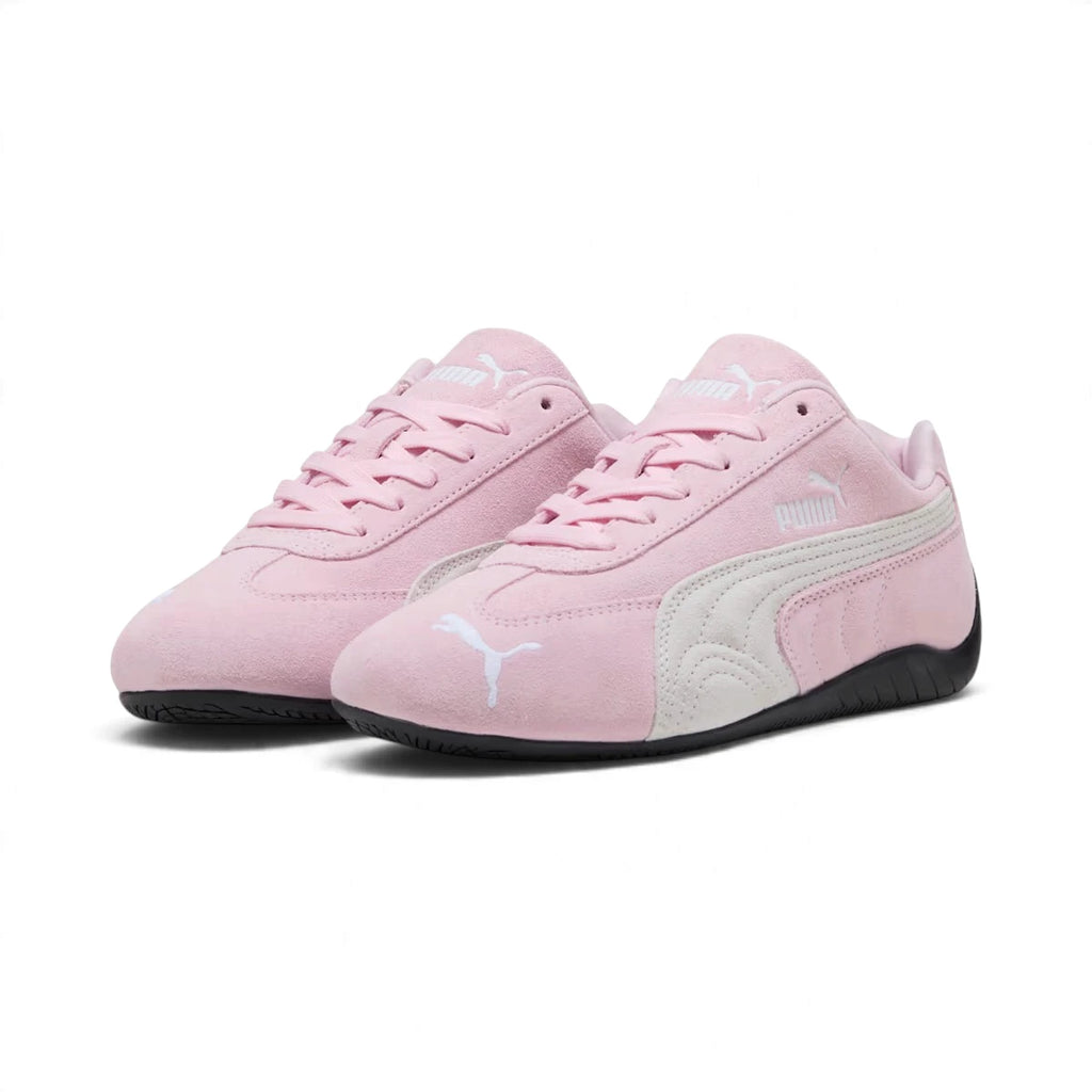 Forward three-quarter angle showcasing both shoes side by side, highlighting the low-slung motorsport stance, delicate pastel hue, contrasting white Formstrip, and streamlined toe box.