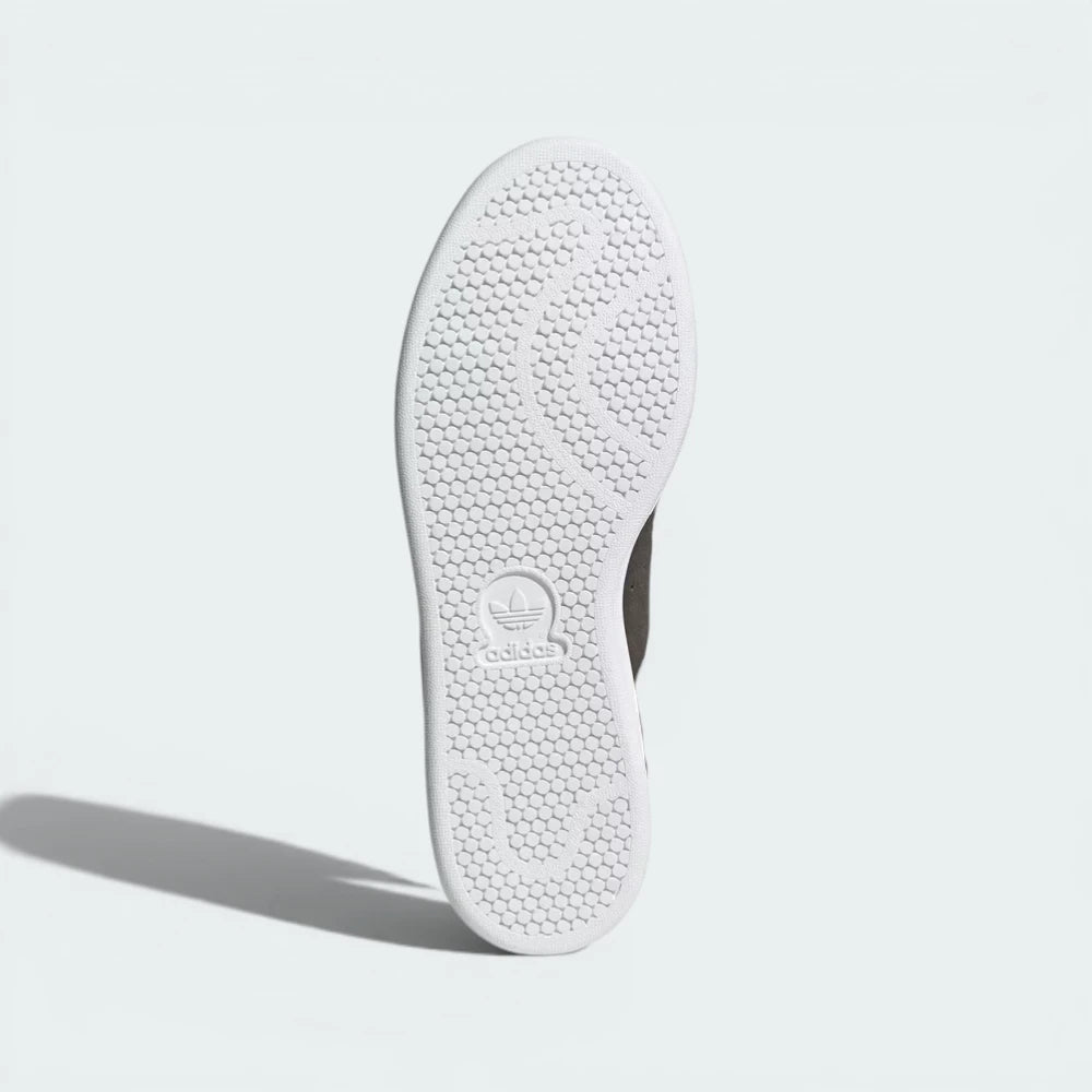 Outsole View: The classic pimpled rubber tread pattern, showcasing the uniform Cloud White finish.