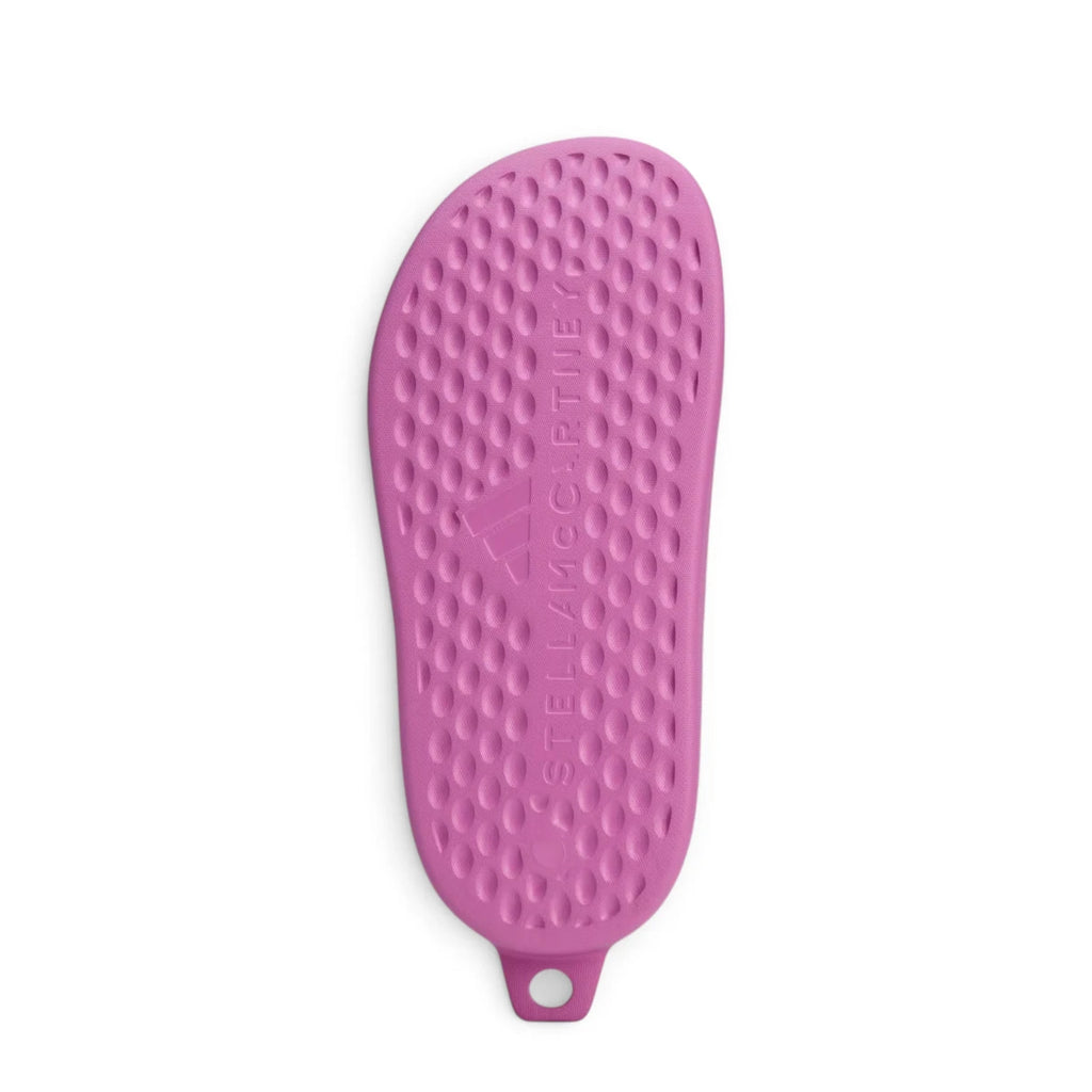 Bottom-down view of the sole, revealing the all-over circular traction pod pattern and debossed Stella McCartney branding across the arch.