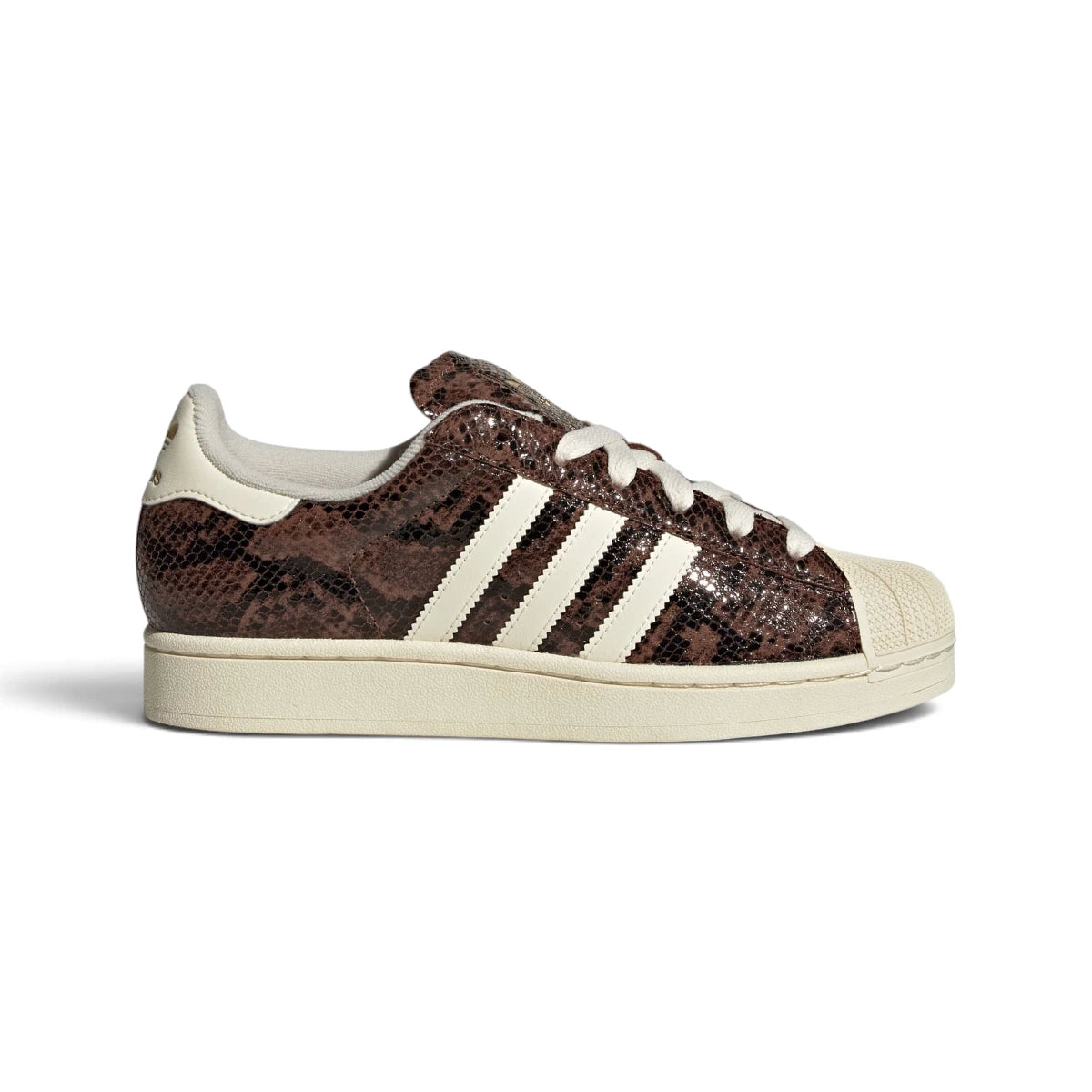 Studio lateral shot of the adidas Women's Superstar II in Preloved Brown and Cream White, highlighting the snakeskin-textured brown leather upper, creamy white serrated three stripes, classic rubber shell toe, and matching rubber cupsole.