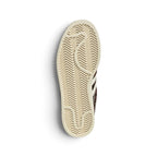 Bottom-down view of the cream rubber outsole, showcasing the heritage herringbone traction pattern and central embossed adidas branding.