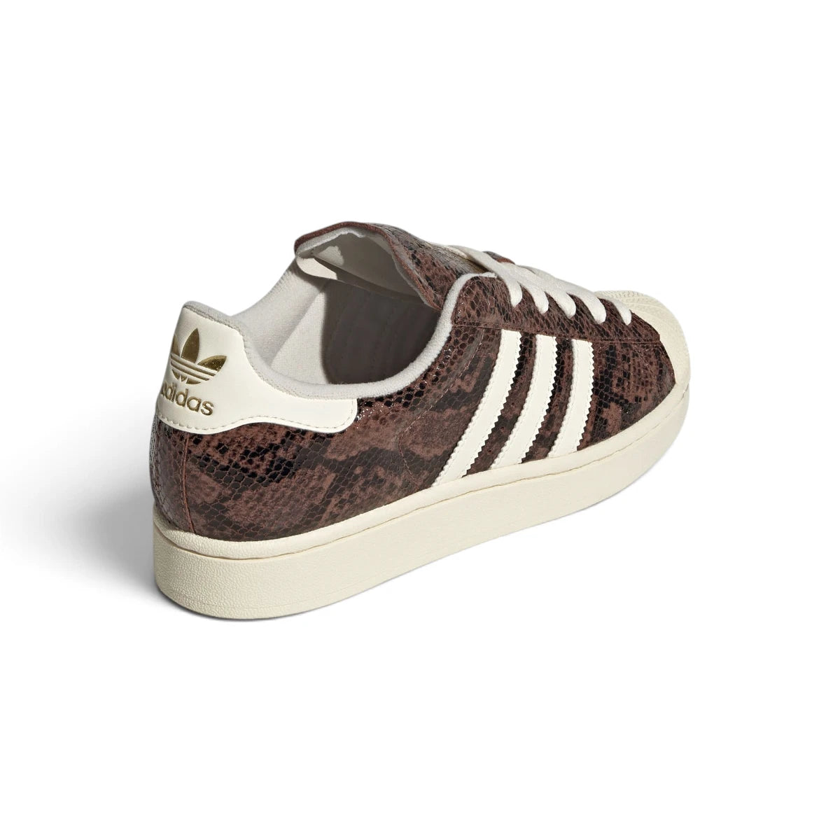 Rear-facing perspective focusing on the cream white leather heel tab with gold foil Trefoil branding, stitched rear collar seams, and the clean sidewall wrap of the sole.