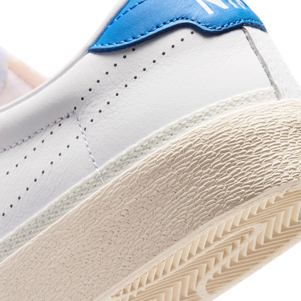 Close-up of the lateral heel transition, highlighting the textured vulcanised sidewall and the herringbone rubber outsole wrap.