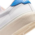 Close-up of the lateral heel transition, highlighting the textured vulcanised sidewall and the herringbone rubber outsole wrap.
