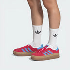 Model wearing the adidas gazelle bold