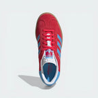Looking down at the pink suede lacing system and the textured tongue branding.