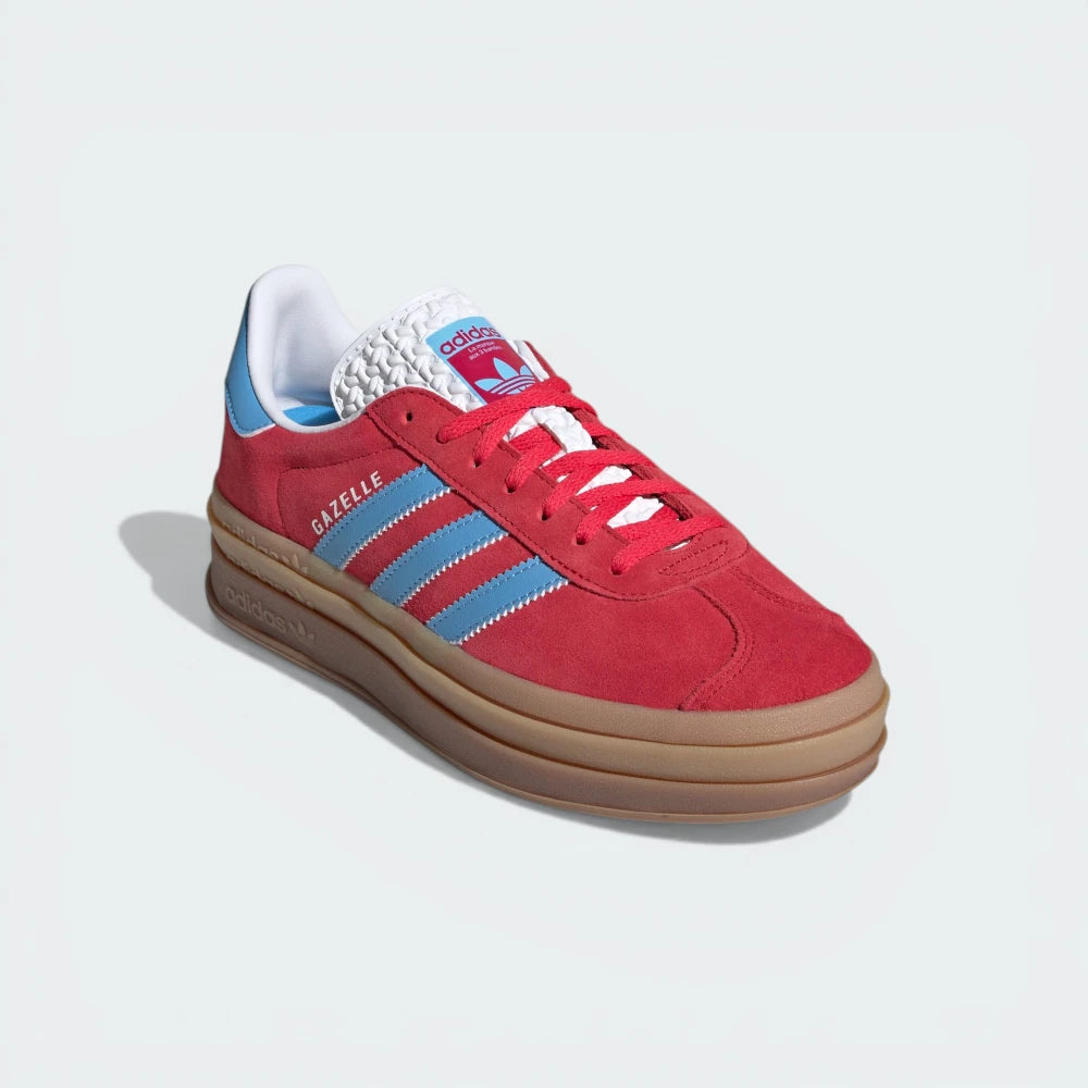 Emphasising the chromatic depth between the pink suede and the electric blue accents.
