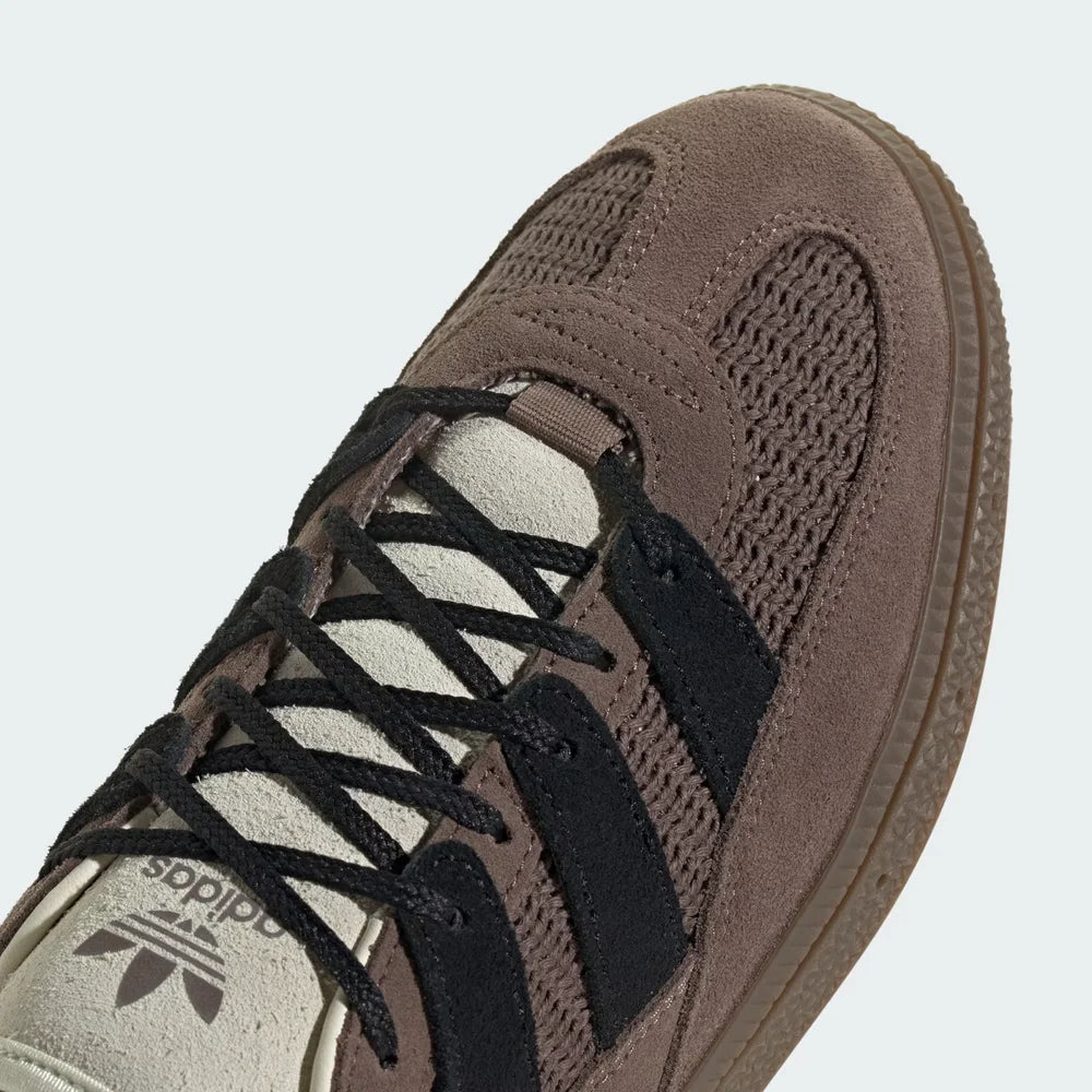 A close-up of the mixed-material grain and the precision stitching around the toe box.