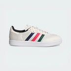 Side Profile Image: The Chalk White Velosamba, highlighting the multicolour 3-Stripes and the recessed cleat area in the white outsole.