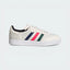 Side Profile Image: The Chalk White Velosamba, highlighting the multicolour 3-Stripes and the recessed cleat area in the white outsole.