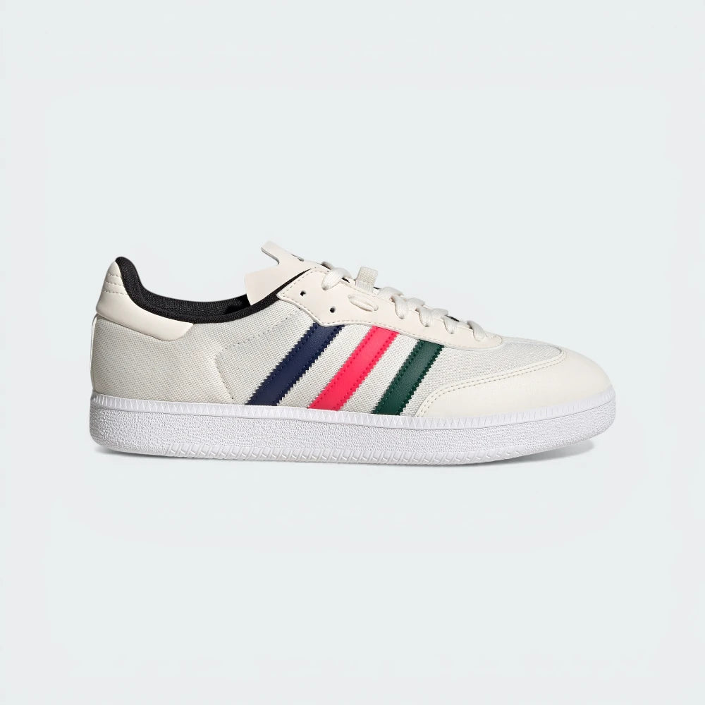 Side Profile Image: The Chalk White Velosamba, highlighting the multicolour 3-Stripes and the recessed cleat area in the white outsole.