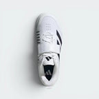 Focuses on the locked-in lace-and-strap combo layout, displaying the perfect symmetry of the white textile tongue, the broad black closure strap, and the distinctively wide, roomy shape of the front toe box matrix.