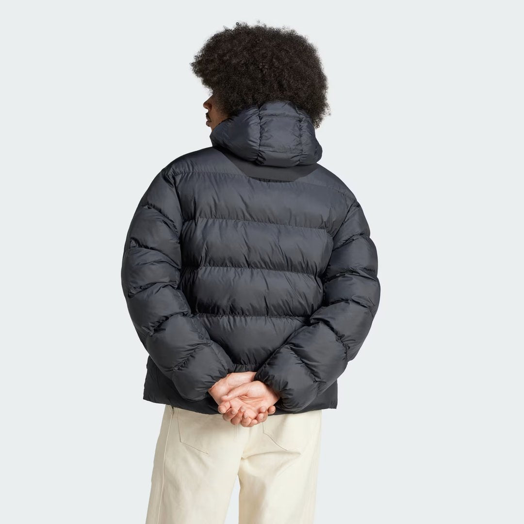 Adidas Tonal Hooded Puffer Jacket in black, back view showcasing the padded design and seamless construction.